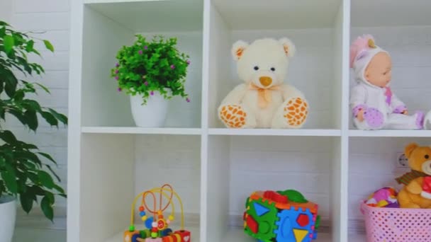 Toys on the childrens shelf in the room. Selective focus. — Stock Video