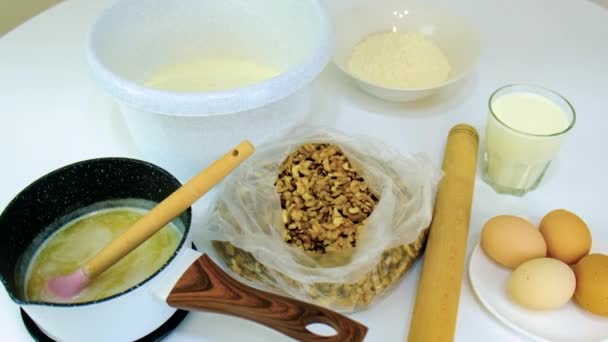 A woman is kneading dough in the kitchen. Selective focus. — Stock Video