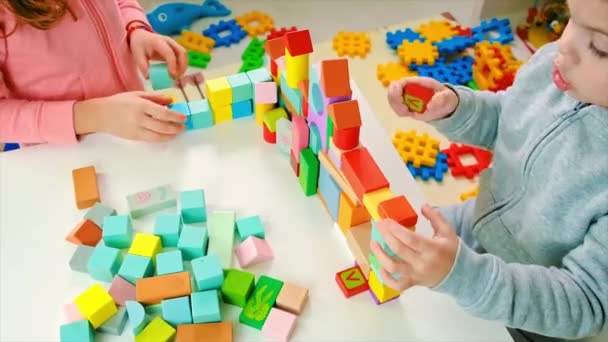 The child plays with toys in the room. Selective focus. — Stock Video