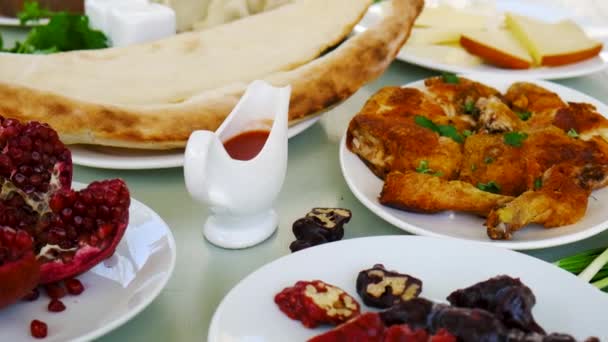 Georgian national cuisine, food on the table in the restaurant. Selective focus. — Stock video