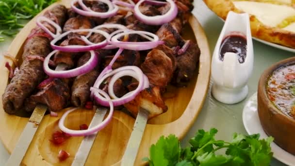 Georgian national cuisine, food on the table in the restaurant. Selective focus. — Vídeos de Stock
