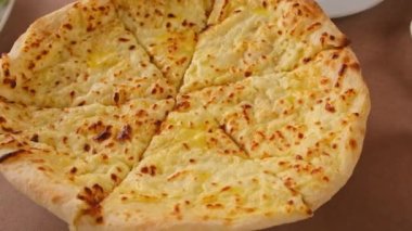Megrelian khachapuri on the table Georgian cuisine. Selective focus.