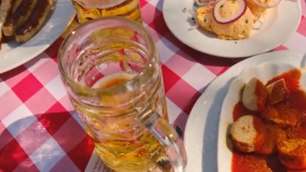 Bavarian beer in a brasserie and food. Selective focus. — Stockvideo