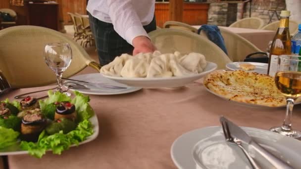 Khinkali on the table Georgian cuisine. Selective focus. — Video