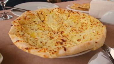 Megrelian khachapuri on the table Georgian cuisine. Selective focus. Food.