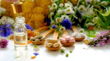 Homeopathy and dietary supplements with medicinal herbs. Selective focus. Nature.
