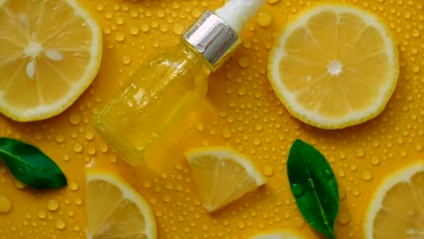 Lemon Essential Oil Yellow Background Water Drops Selective Focus Food — стоковое видео