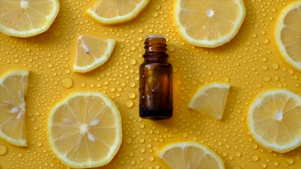 Lemon Essential Oil Yellow Background Water Drops Selective Focus Food — Vídeos de Stock