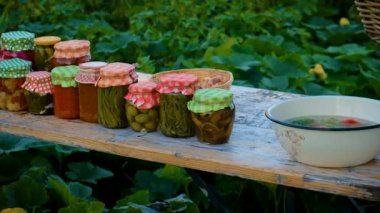 Senior woman makes preservation of vegetables. Selective focus. People.
