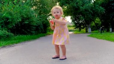 The child eThe child eats watermelon in summer. Selective focus.ats watermelon in summer. Selective focus. Kid.