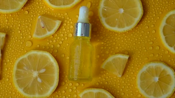 Lemon Essential Oil Yellow Background Water Drops Selective Focus Food — 图库视频影像