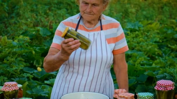 Senior Woman Makes Preservation Vegetables Selective Focus People — Vídeo de Stock