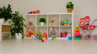 Children room with toys on the shelves. Selective focus. White.