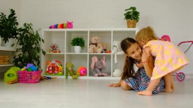 The sisters children are playing in the room. Selective focus. Kid.