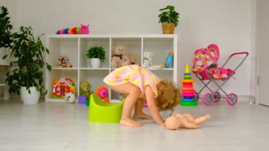 The child sits on the potty. Selective focus. Kid.