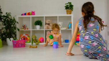 The sisters children are playing in the room. Selective focus. Kid.