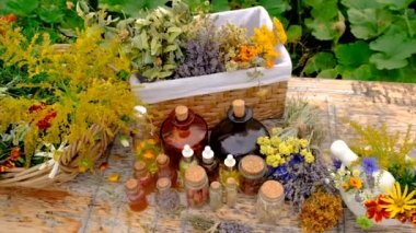Medicinal herbs and tinctures on the table. Selective focus. Nature.