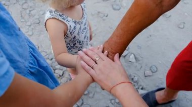 Grandmother and grandchildren friends hands together. Selective focus. People.