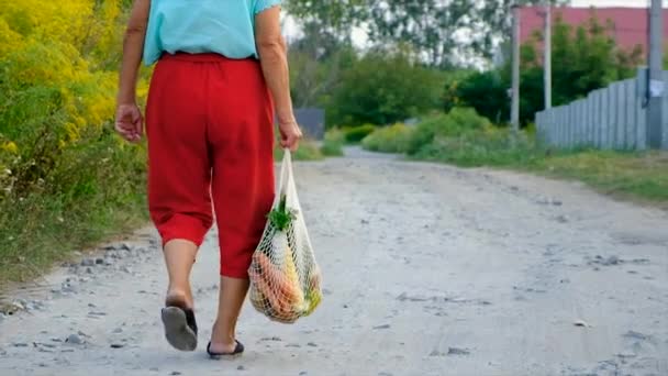 Grandmother Carries Vegetables Shopping Bag Selective Focus Food — Vídeo de stock