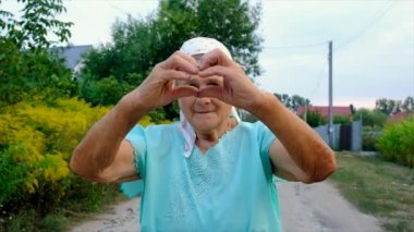 Beautiful portrait of an old woman. Selective focus. People.
