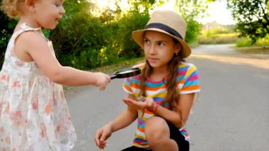 The child is playing with the frog. Selective focus. Kid.