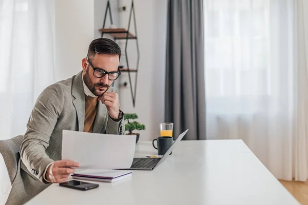 Serious Worried Businessman Analyzing Documents Male Entrepreneur Working Laptop Desk — стоковое фото