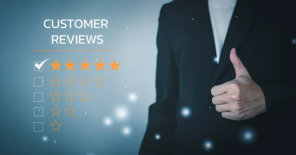 Customer reviews 5 Stars. Customer service evaluation and satisfaction. Smile rating to feedback survey concept. Man wearing black suit and Hand making good sign.