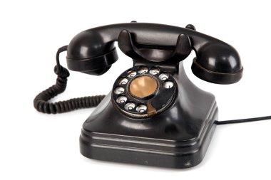 Eski telefon, beyaz arkaplanda fotoğraflanmış nesneler