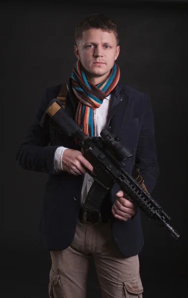 Portrait of young soldier pointing with rifle — Stock Photo, Image