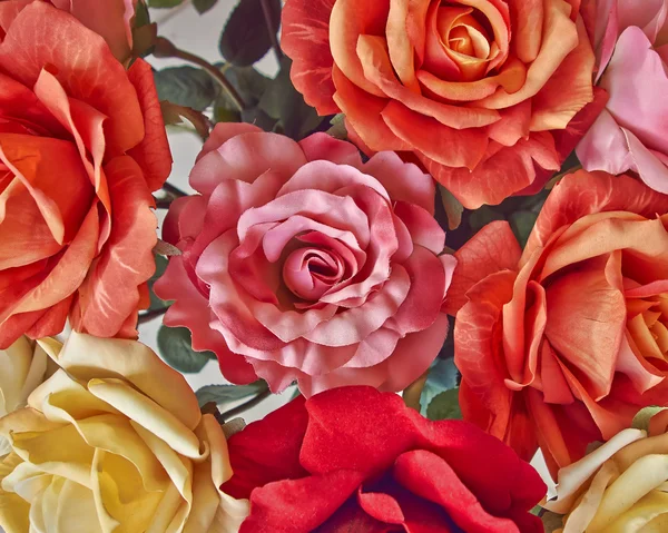 Variedade de rosas têxteis coloridas — Fotografia de Stock