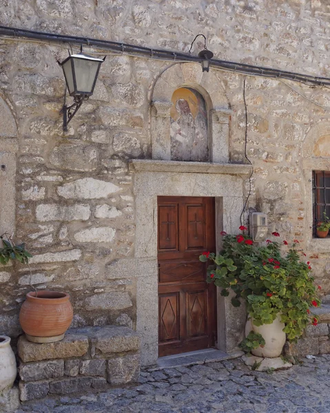 Church entrance and flowerpots — Stock Photo, Image