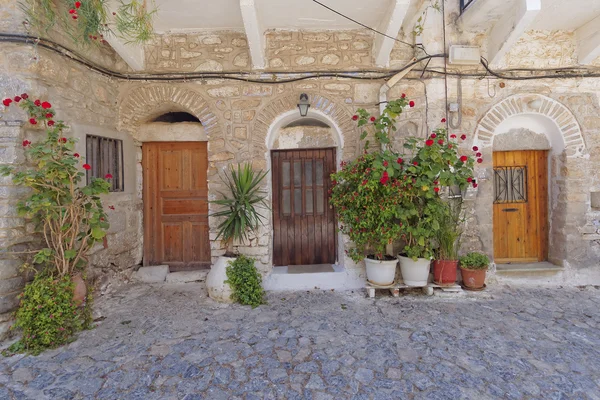 Doors and flowerpots, Greece — Stock Photo, Image