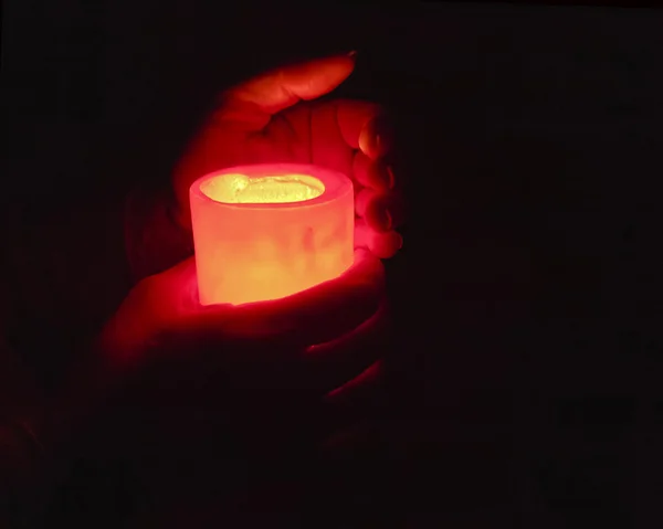 Hands holding candle — Stock Photo, Image