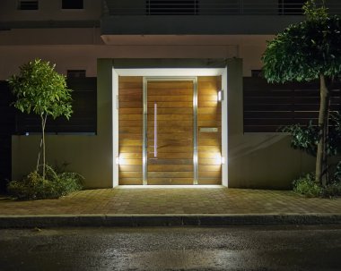 Contemporary house entrance night view clipart