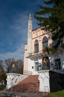 Cherniatyn, Ukraine - 16.08.2021: west facade, staircase with lion sculptures guard entrance, coquina towers, polish noble Ignacy Witoslawski palace, sightseeing tour landmark