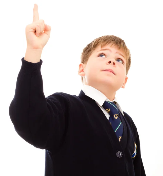 Schoolboy in his uniform points upwards. — Stock Photo, Image