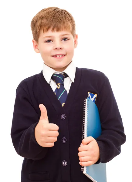 Feliz sorrindo menino da escola mostrando polegar para cima . Fotos De Bancos De Imagens