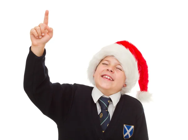 Laughing boy in santa hat. Isolated on white. — Stock Photo, Image