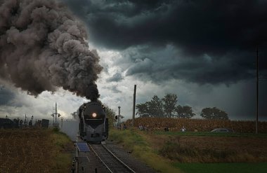 Antique Restored Steam Freight Train Approaching Blowing Smoke and Steam