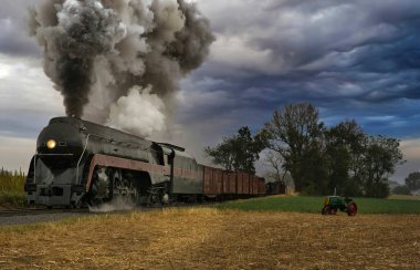 Antique Restored Steam Freight Train Approaching Blowing Smoke and Steam