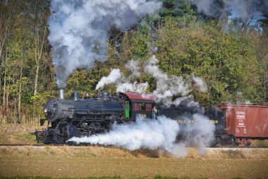 Restored Antique Steam Freight Train Passing Blowing Smoke and Lots of Steam
