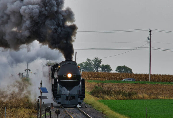 Antique Restored Steam Freight Train Approaching Blowing Smoke and Steam