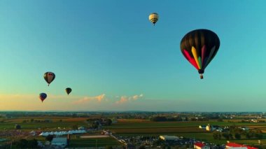 Bird in Hand, Pennsylvania, September 18, 2021 - Drone View of a Multiple Hot Air Balloons Floating in the Sky During a Balloon Festival on a Sunny Day