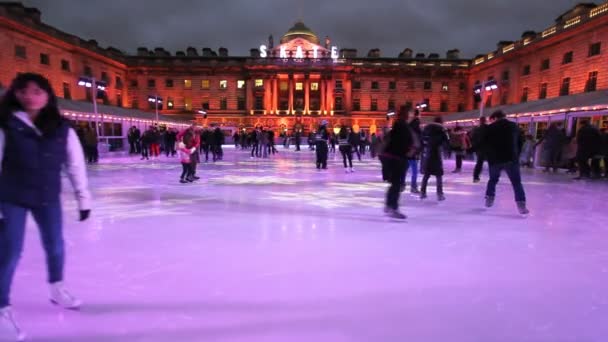 Skaters on a ice rink in London — Stock Video