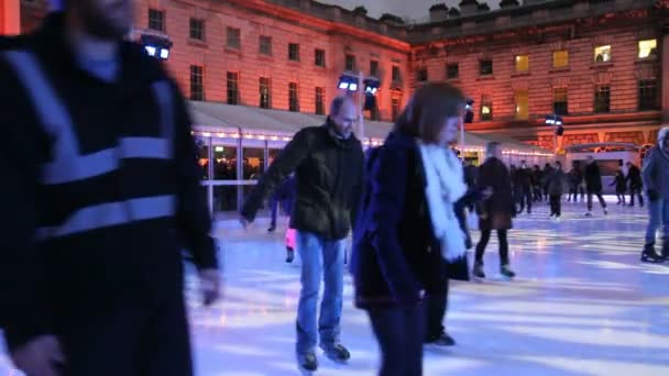 Skaters on a ice rink in London — Stock Video