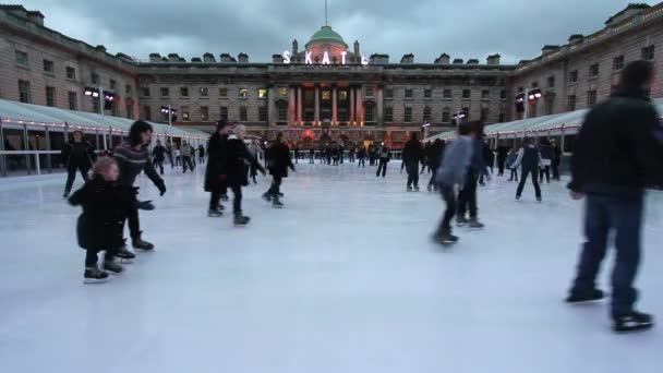 Skaters on a ice rink in London — Stock Video