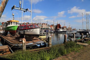 Volendam, The Netherlands - September 12, 2019: Wharf for fishing boats in the fishing harbor of Volendam, The Netherlands on September 12, 2019