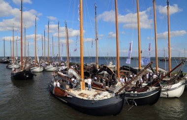 Volendam, The Netherlands - September 12, 2019: Historical sailboats in the historical Volendam fishing harbor participate in a regatta in Volendam, The Netherlands on September 12, 2019