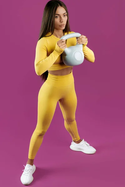Sporty Young Brunette Woman Doing Functional Exercises Gray Kettlebell Purple — Stock fotografie