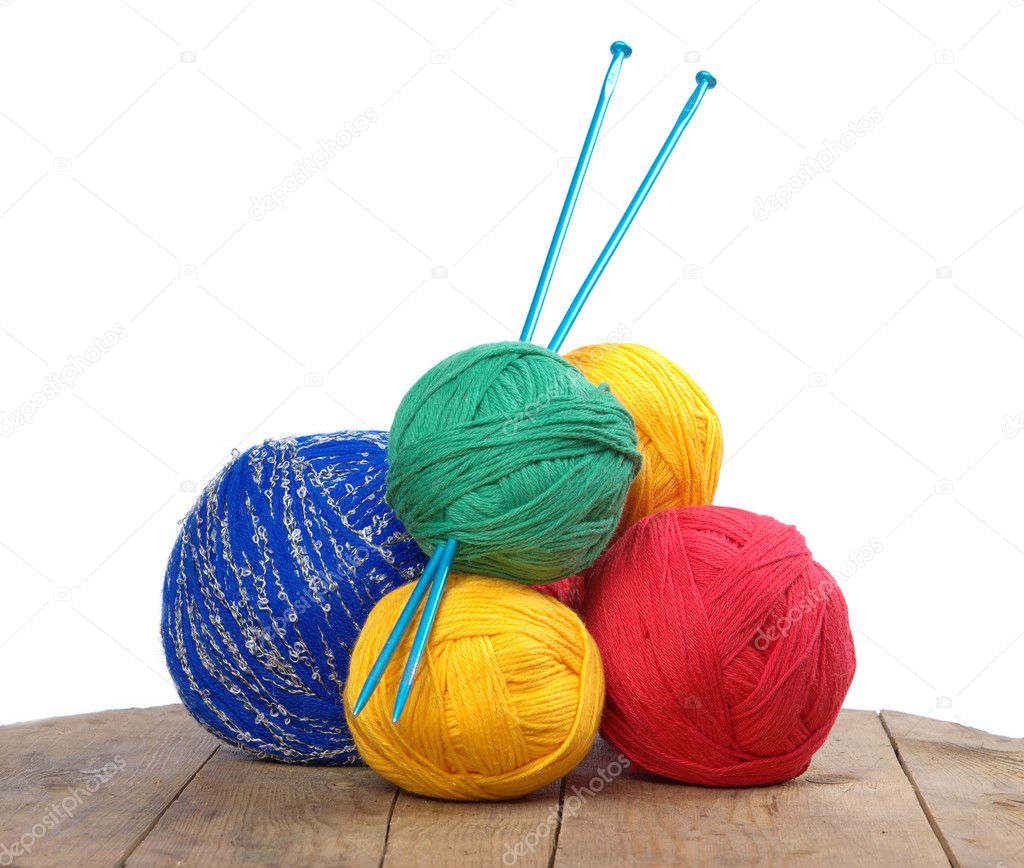 Balls of colored yarn on the boards